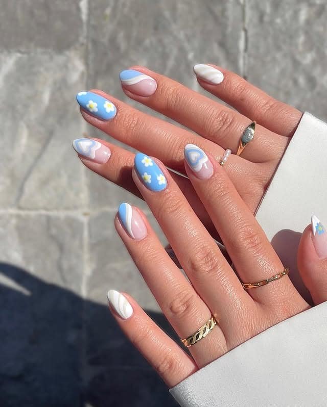 11. Pastel Blue Daisy Heart Almond Nails - short spring break nail ideas