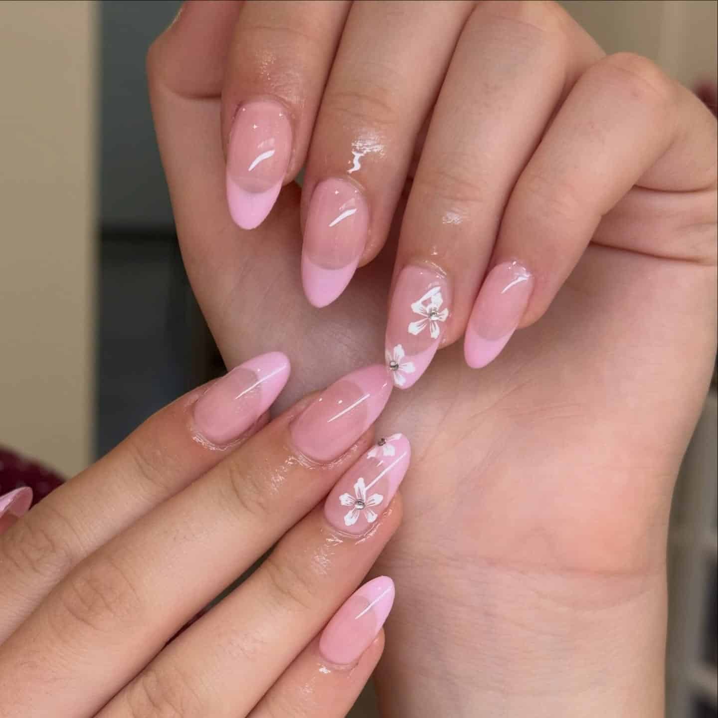 14. Soft Pink Floral French Almond Nails - short spring break nail ideas