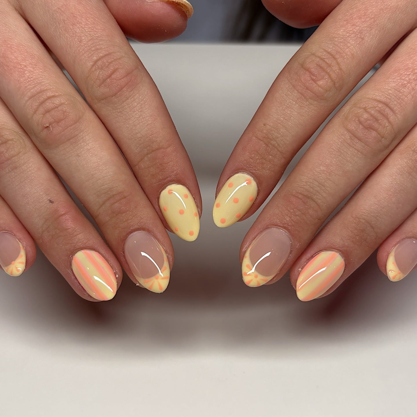 16. Butter Yellow Polka Dot Almond Nails - short spring break nail ideas