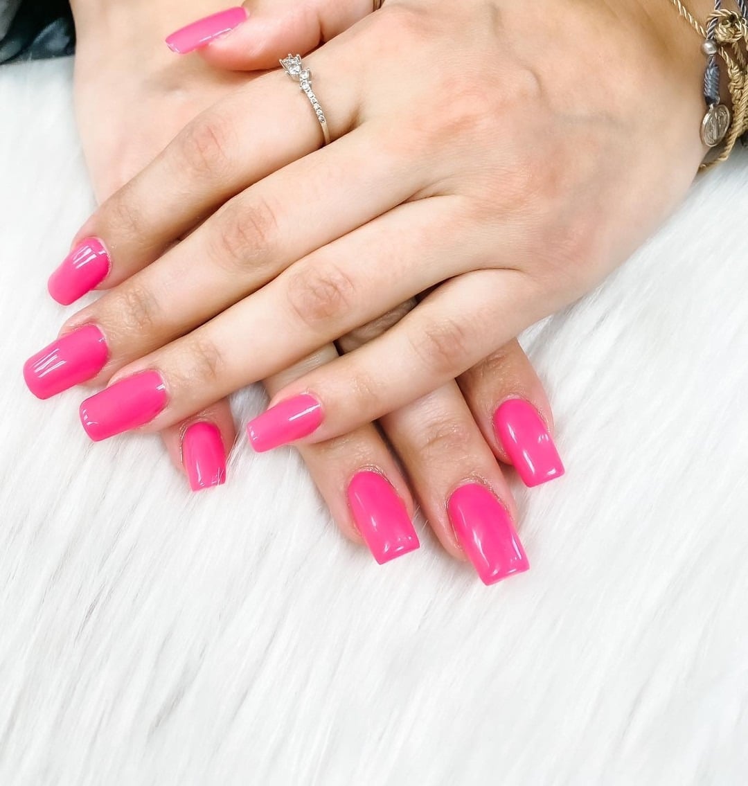 17. Bright Pink Glossy Square Nails - short spring break nail ideas