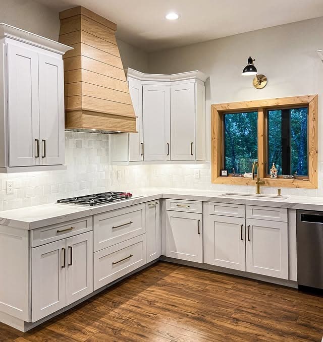 4. White Cottage Kitchen with Natural Wood Accents - cottage kitchen ideas