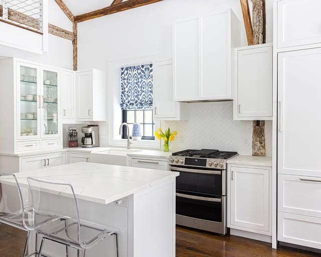11. Bright White Cottage Kitchen with Rustic Beam Accents - cottage kitchen ideas