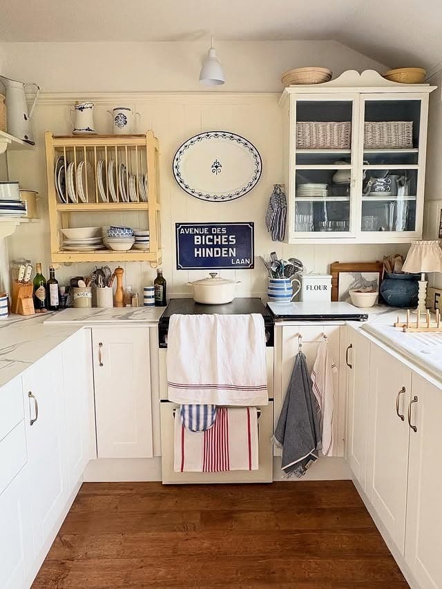 12. Cream and Blue Cottage Kitchen with Vintage Display Shelving - cottage kitchen ideas