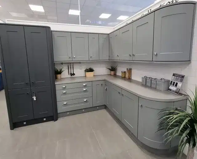 1. Classic Light Grey Shaker Kitchen With Curved Cabinet Detailing - light grey kitchen ideas