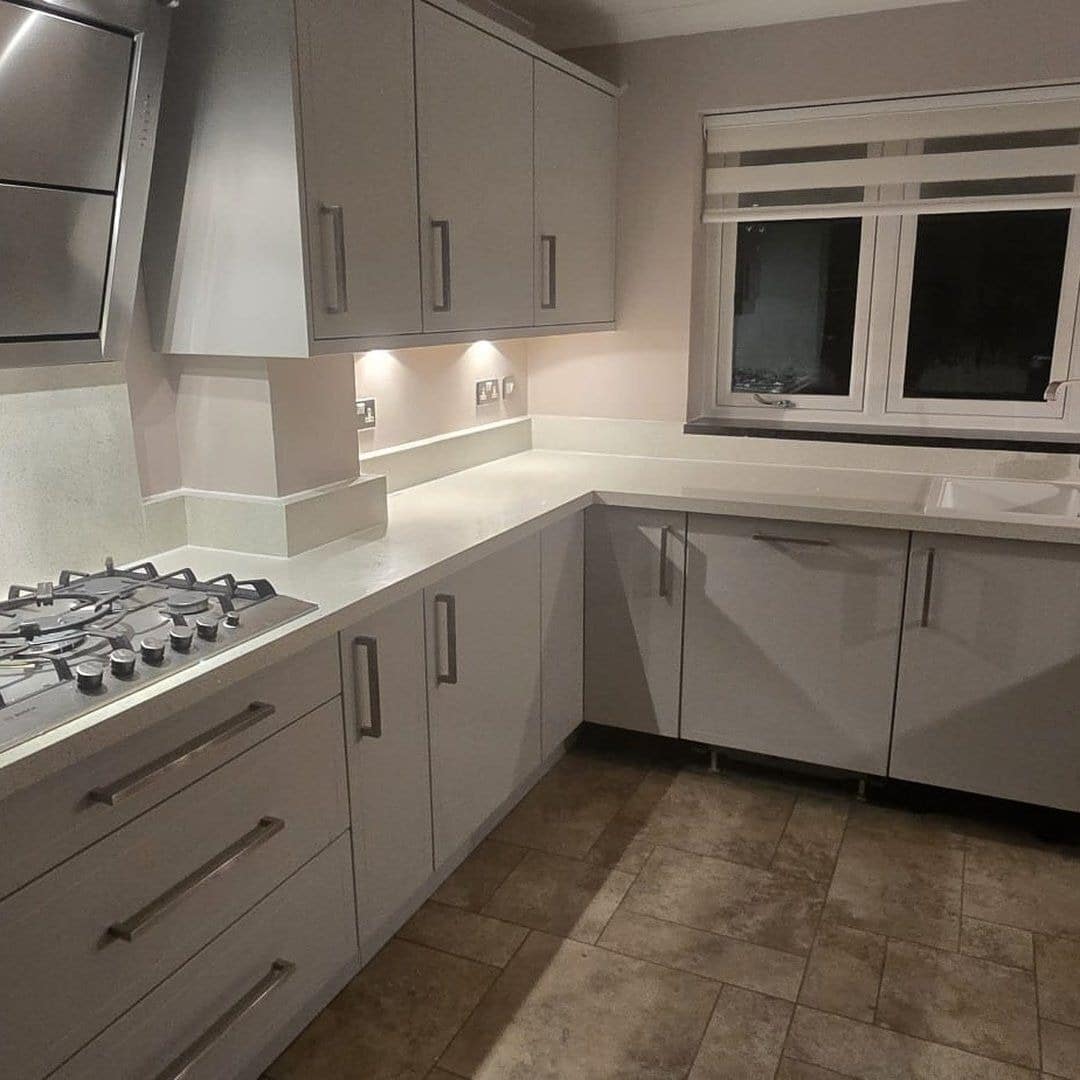 2. Light Grey Slab Kitchen With Sleek Contemporary Styling - light grey kitchen ideas