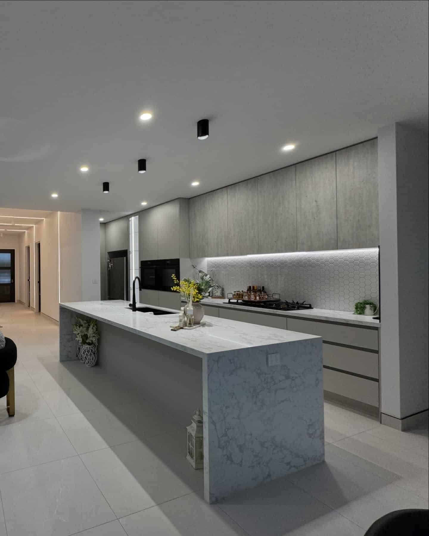 6. Minimalist Light Grey Kitchen With Waterfall Island - light grey kitchen ideas
