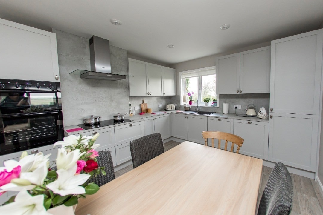 7. Light Grey Shaker Kitchen With Natural Wood Accents - light grey kitchen ideas