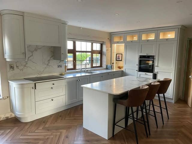 9. Light Grey Kitchen With Rounded Cabinet Features - light grey kitchen ideas