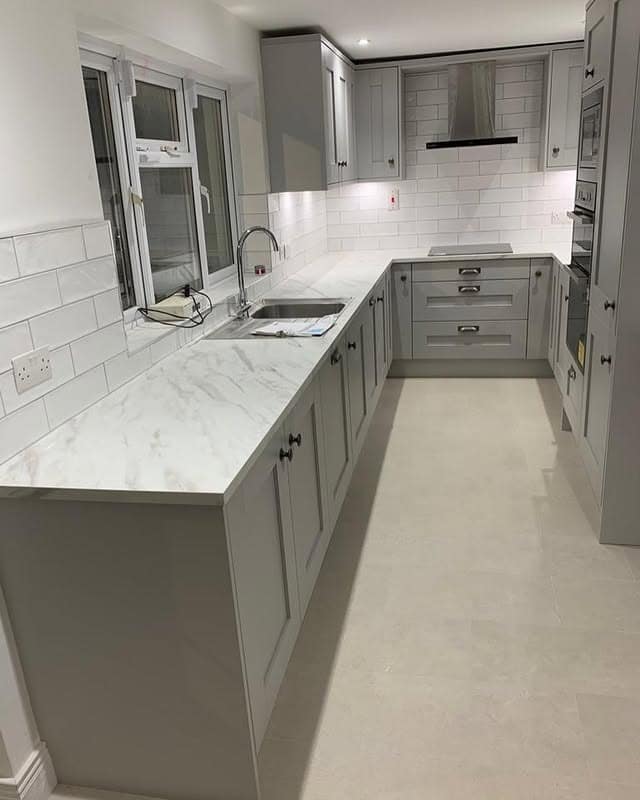 12. Compact Light Grey Kitchen With Marble-Effect Worktops - light grey kitchen ideas