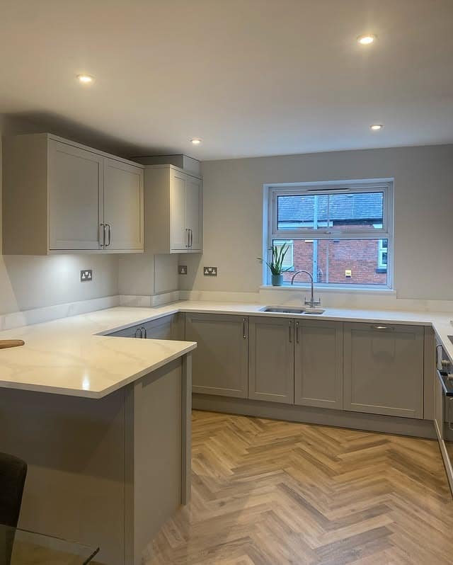 16. Light Grey U-Shaped Kitchen With Herringbone Flooring - light grey kitchen ideas