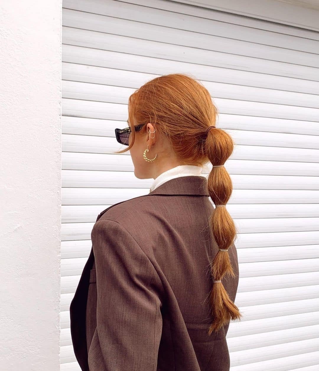 2. Low Bubble Ponytail on Copper Ginger Hair - Bubble Ponytail Hairstyles