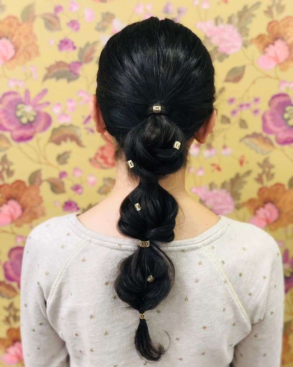 4. Twisted Bubble Ponytail on Black Hair - Bubble Ponytail Hairstyles