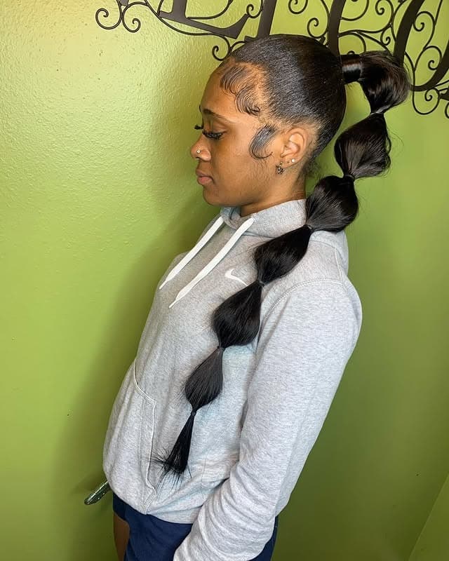 5. Sculpted Bubble Ponytail on Natural Black Hair - Bubble Ponytail Hairstyles