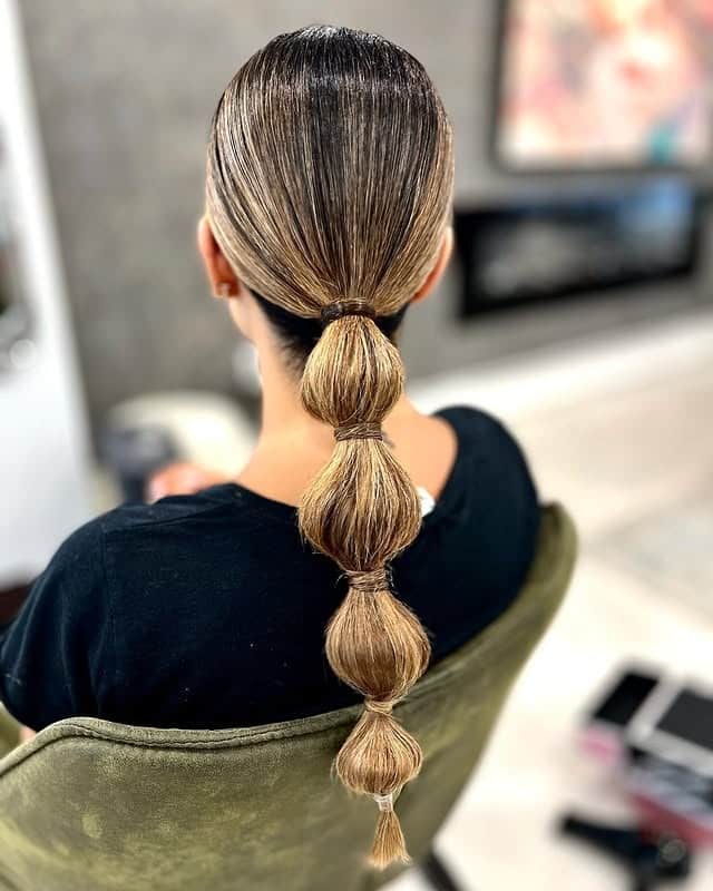 8. Classic Bubble Ponytail on Dark Blonde Hair - Bubble Ponytail Hairstyles