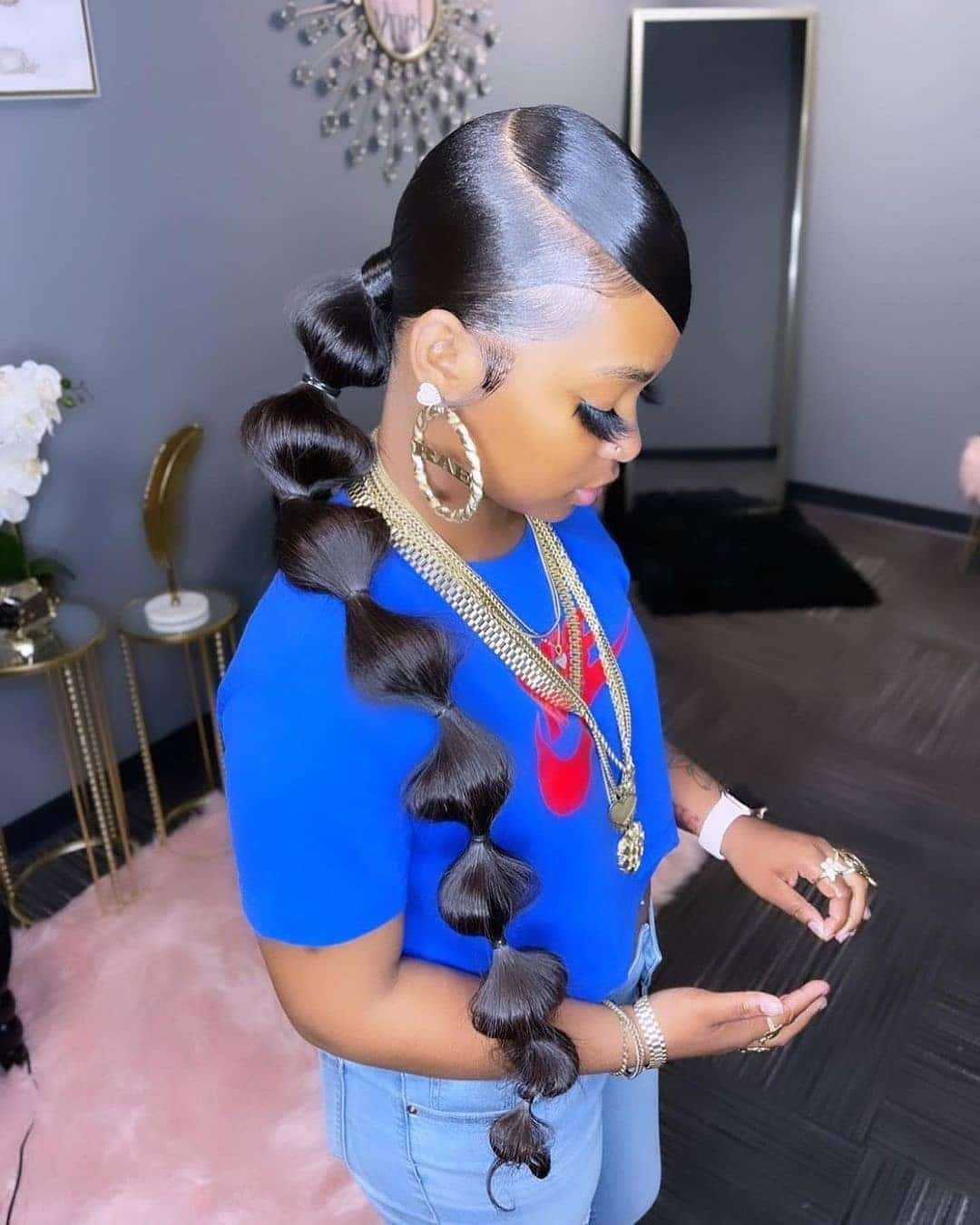 11. Sleek Bubble Ponytail on Jet Black Hair - Bubble Ponytail Hairstyles