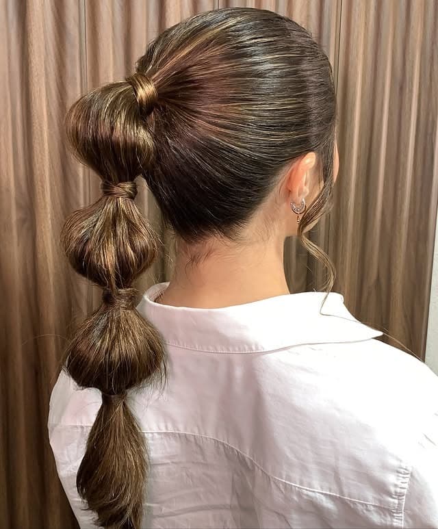 19. Voluminous Bubble Ponytail on Medium Brown Hair - Bubble Ponytail Hairstyles