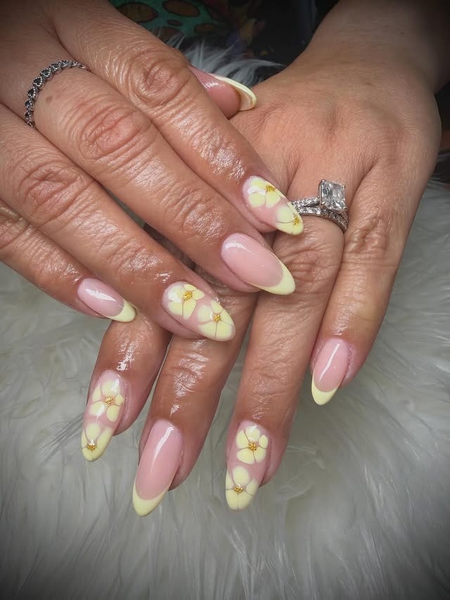 1. Pastel Yellow French Tip Daisy Almond Nails - yellow nail ideas