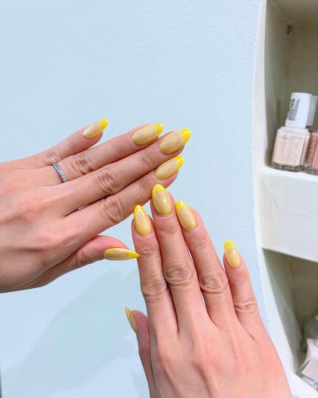 10. Bright Yellow Outline French Tip Nails - yellow nail ideas