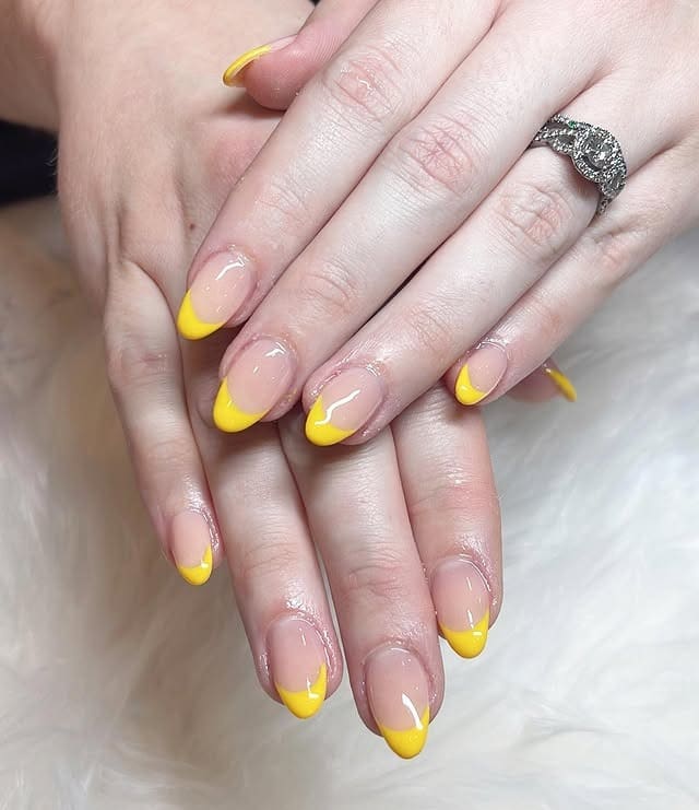 12. Bright Yellow French Tip Almond Nails - yellow nail ideas