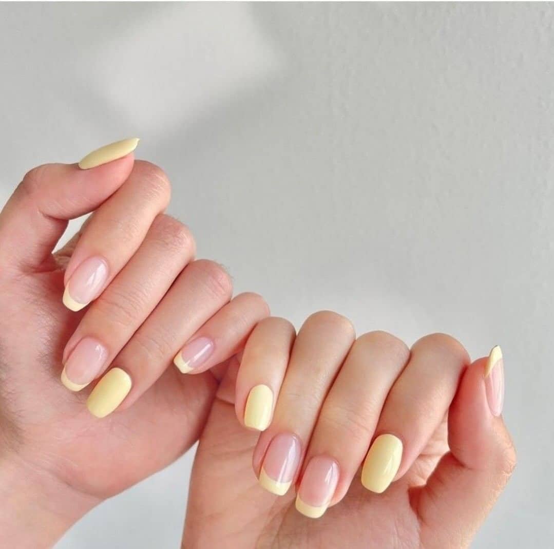 14. Butter Yellow Mixed French and Solid Nails - yellow nail ideas
