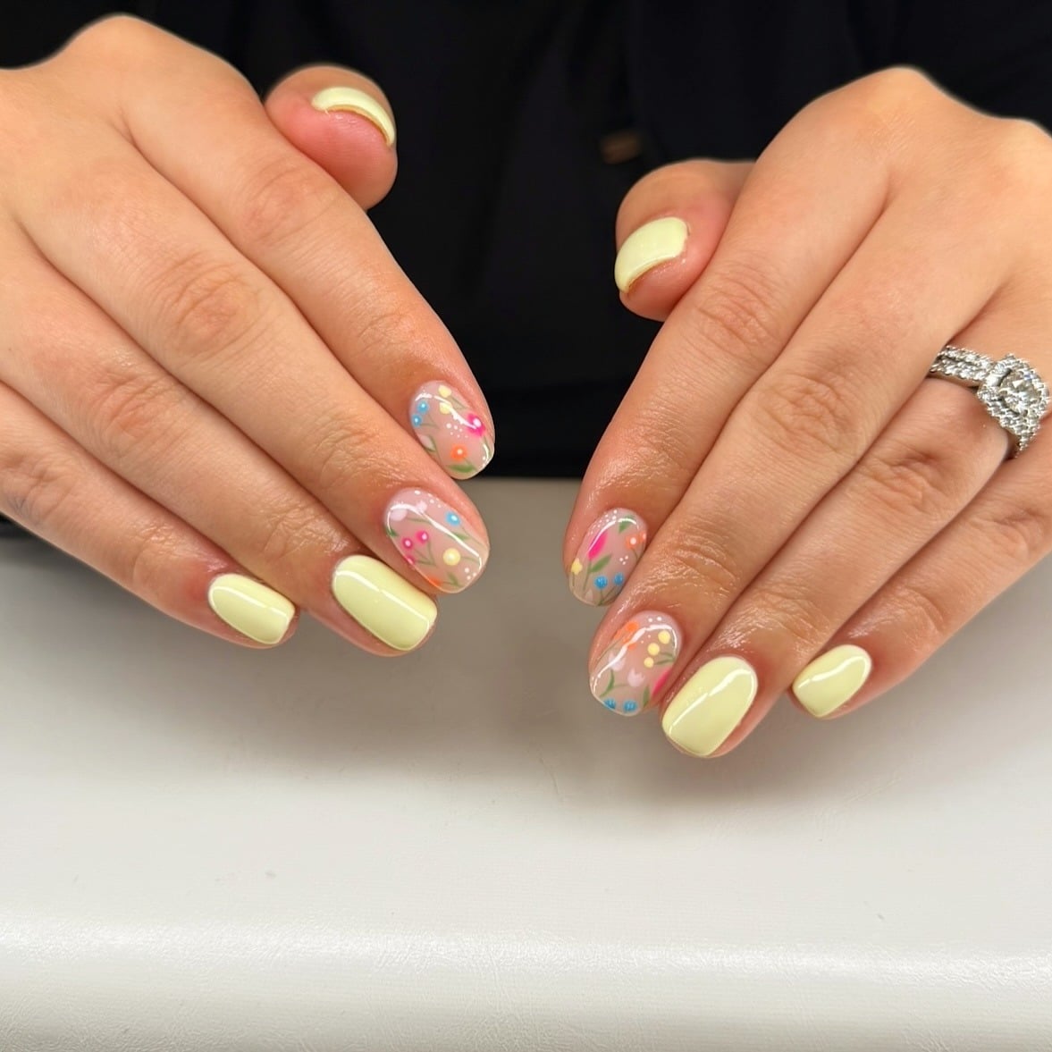 16. Pastel Yellow Floral Accent Short Nails - yellow nail ideas