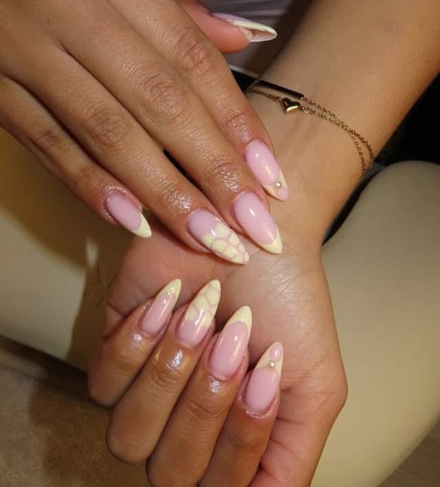 19. Pale Yellow French Tip Lattice Almond Nails - yellow nail ideas