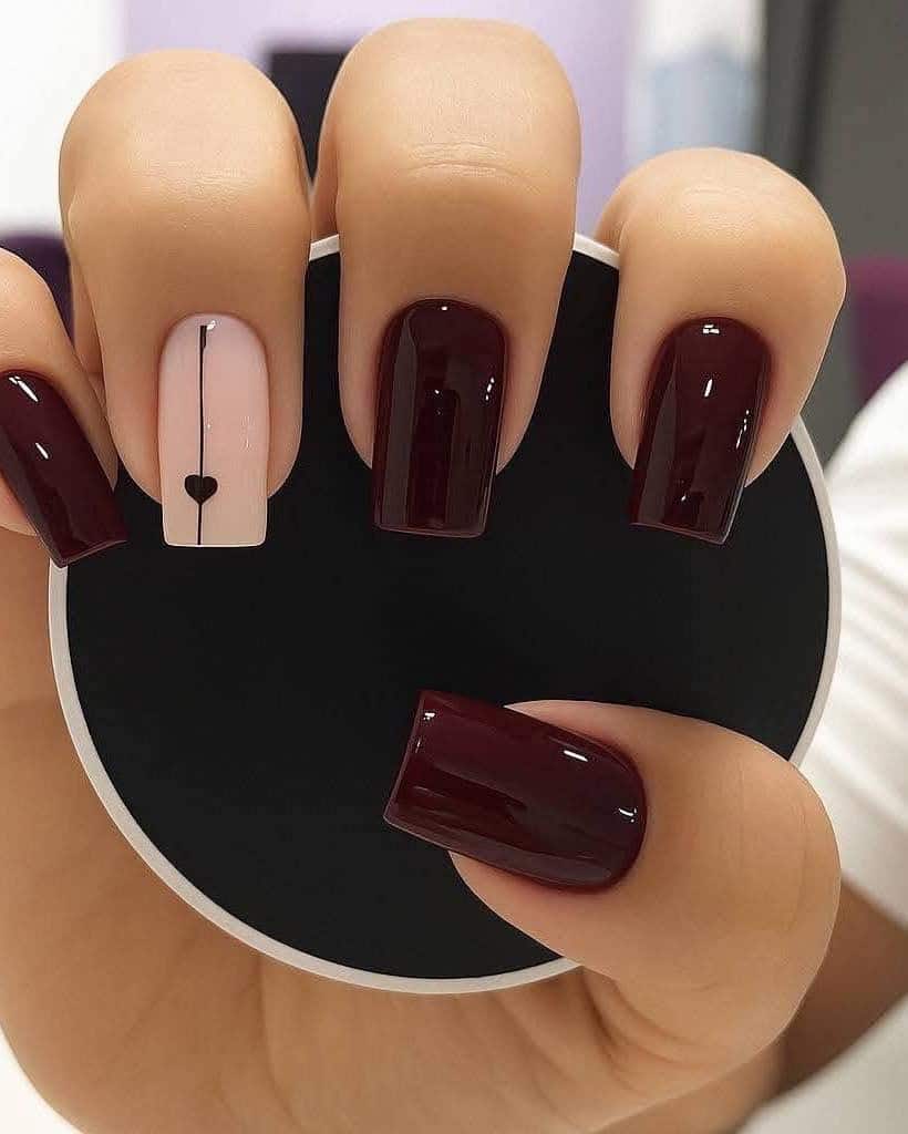 2. Dark Red Coffin Nails with Minimal Heart Accent - dark red coffin nail ideas