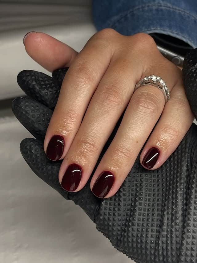 3. Deep Wine Short Oval Nails - dark red coffin nail ideas