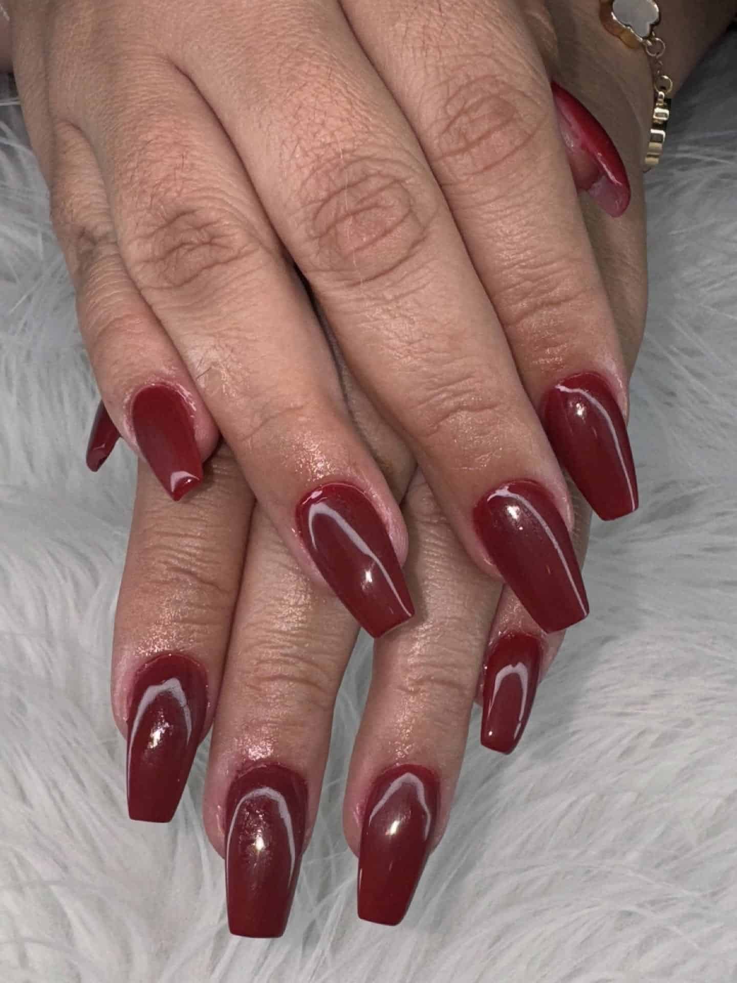 22. Dark Cranberry Coffin Nails with Subtle Shimmer - dark red coffin nail ideas