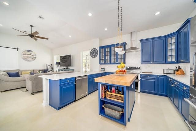 2. Royal Blue Kitchen Cabinets with Natural Wood Island Accent - blue kitchen cabinets ideas