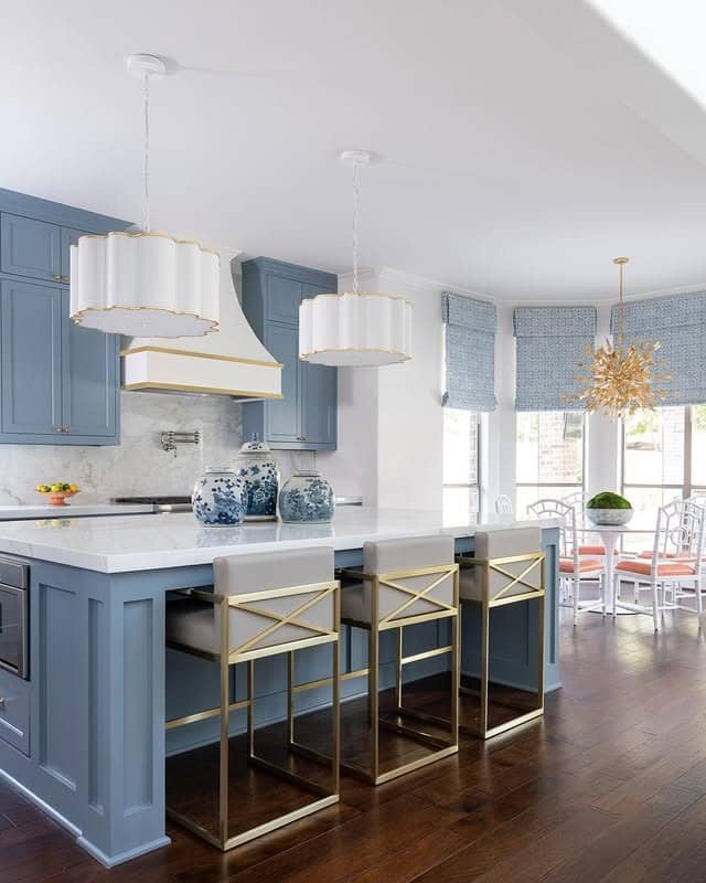 5. Dusty Blue Kitchen Cabinets with Gold Luxury Accents - blue kitchen cabinets ideas