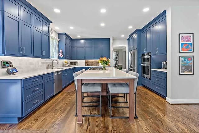 8. Medium Blue Kitchen Cabinets with Warm Wood Flooring - blue kitchen cabinets ideas
