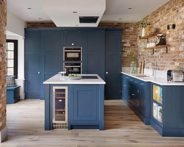 12. Denim Blue Kitchen Cabinets with Exposed Brick Character - blue kitchen cabinets ideas