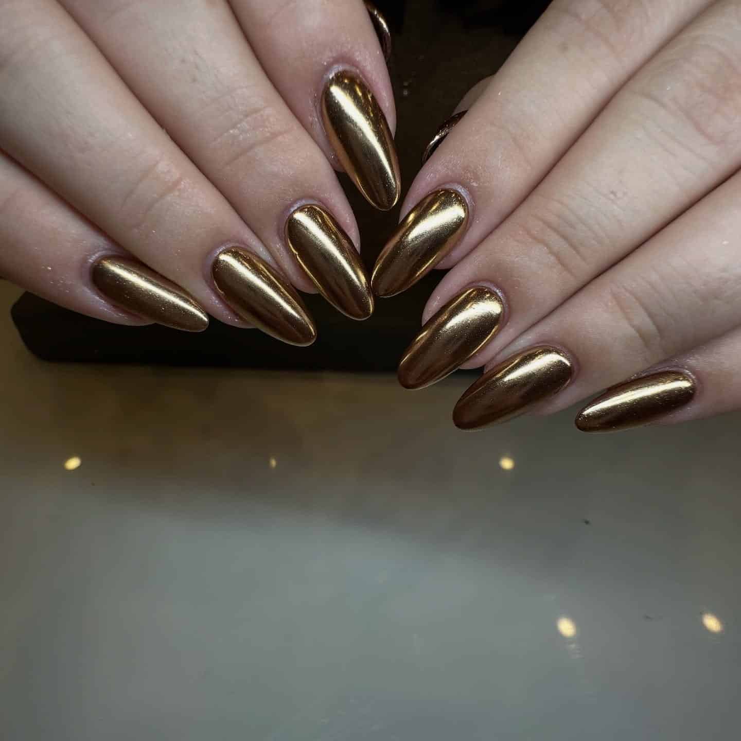 9. Bronze Mirror Chrome Almond Nails - chrome nail ideas