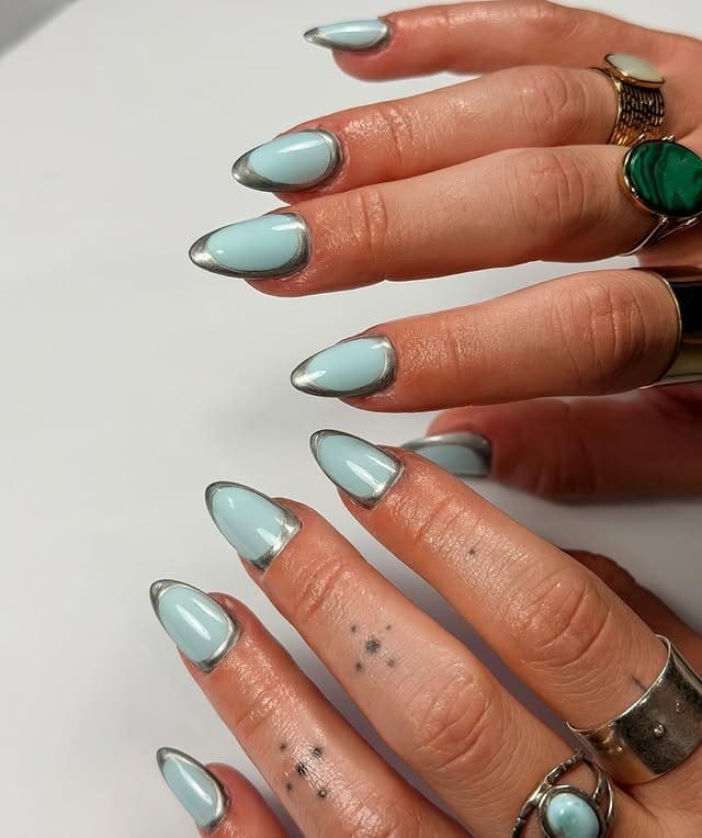 15. Powder Blue Chrome Outline Almond Nails - chrome nail ideas