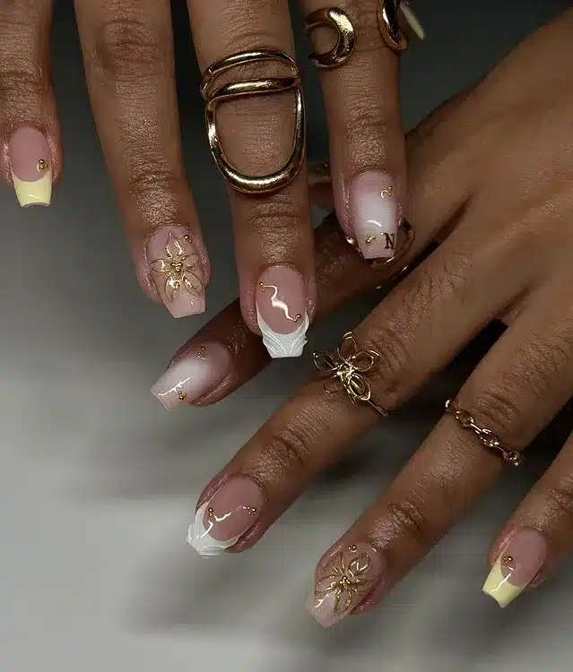 2. Buttercream French Tips with Gold Floral Accents - cute short nail ideas