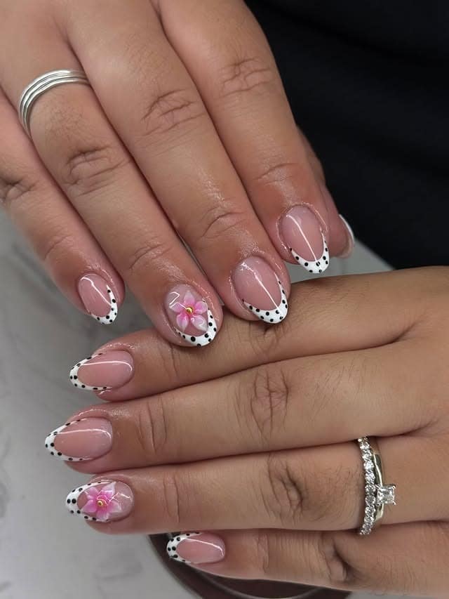 5. Polka Dot French Tip Nails with Pink Flower Accent - cute short nail ideas