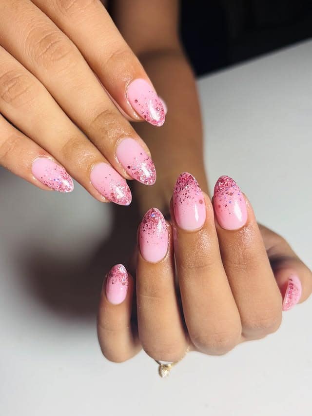 4. Pink Glitter Fade Almond Nails - glitter nail ideas