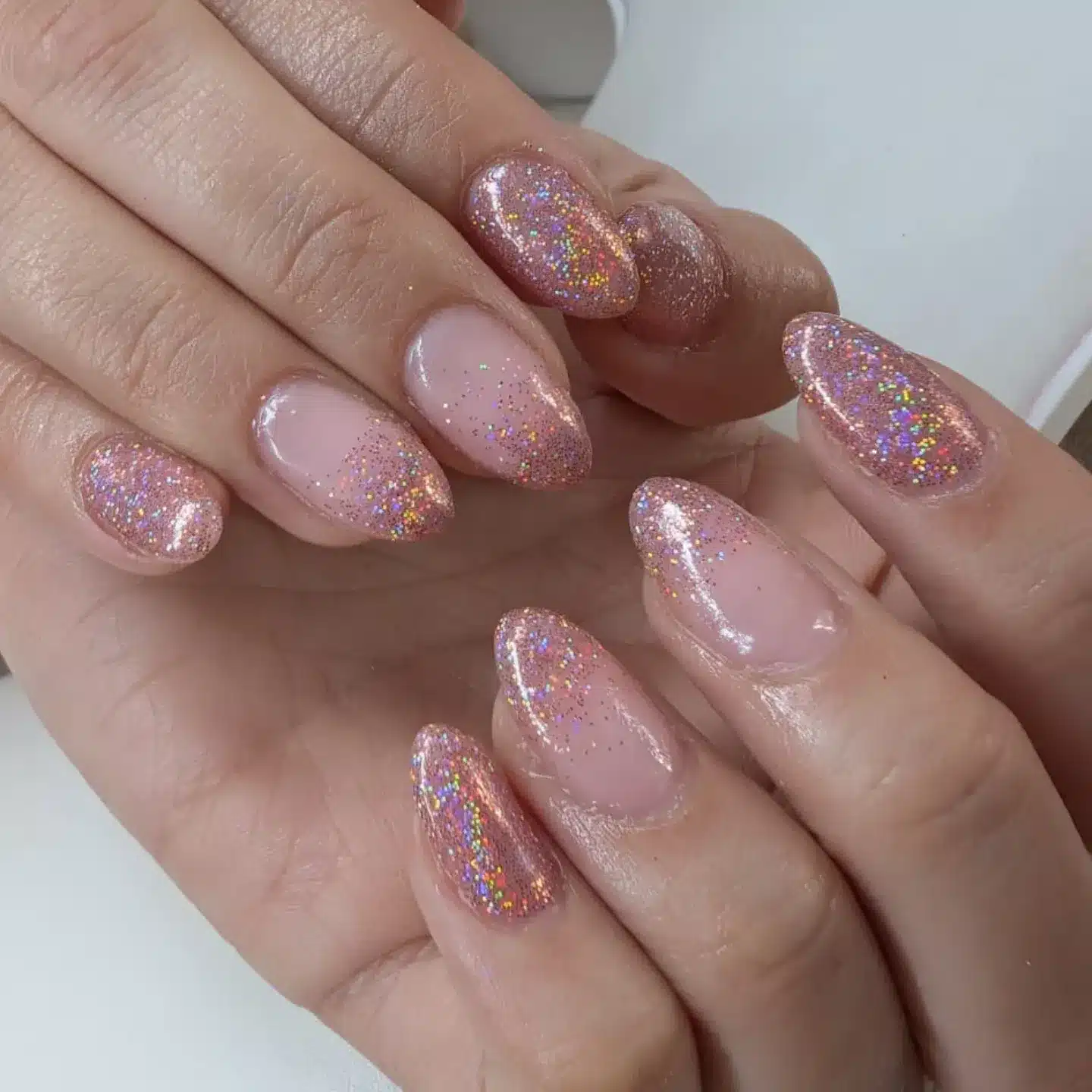 9. Holographic Rose Pink Glitter Almond Nails - glitter nail ideas