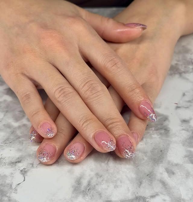 12. Sheer Pink Silver Glitter Fade Short Nails - glitter nail ideas