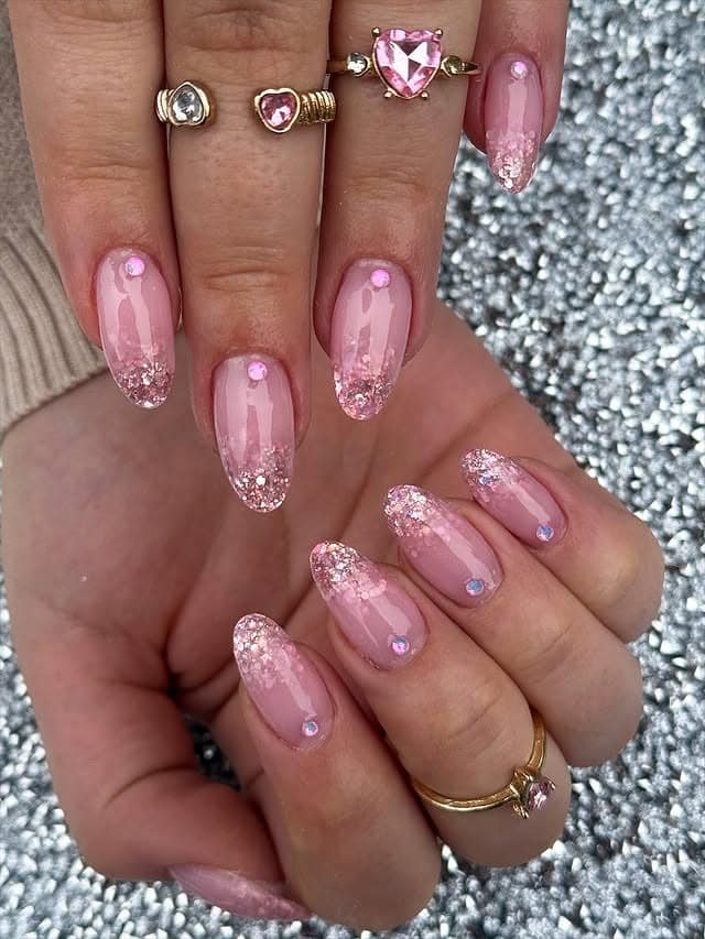 20. Pink Glitter Gradient Almond Nails with Rhinestones - glitter nail ideas