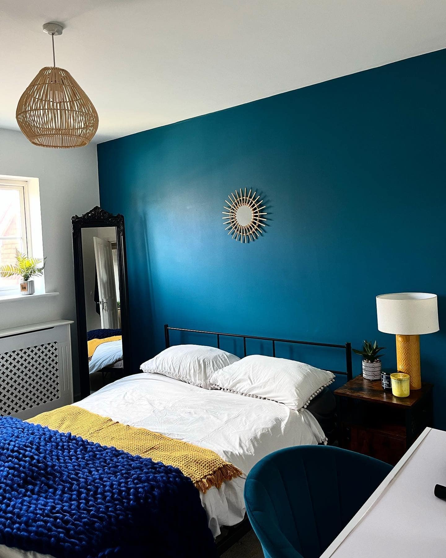 3. Bold Teal Wall With Mustard and Navy Layers - teal bedroom ideas