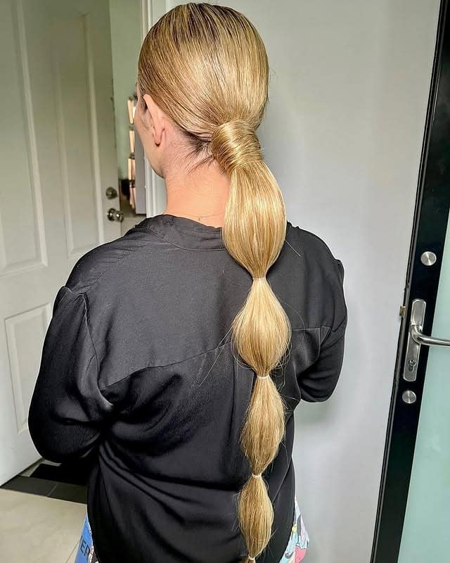 3. Golden Blonde Low Bubble Ponytail - Space Buns Hairstyles