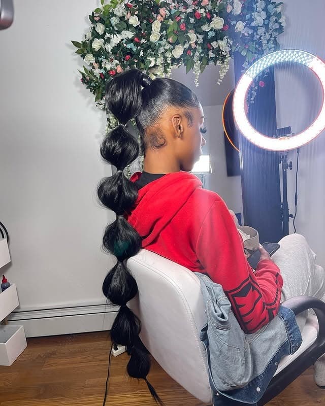 6. Glossy Black Extra-Long Bubble Ponytail - Space Buns Hairstyles