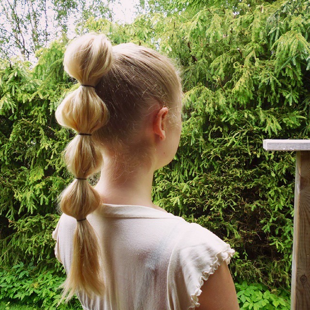 7. Platinum Blonde Bubble Ponytail - Space Buns Hairstyles