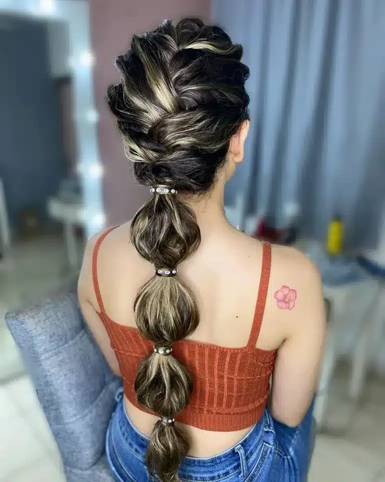 9. Dimensional Brunette Braided Bubble Ponytail - Space Buns Hairstyles