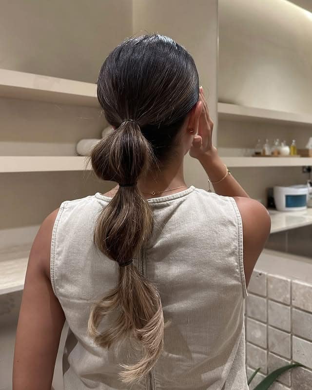 16. Dark Brunette Low Bubble Ponytail - Space Buns Hairstyles