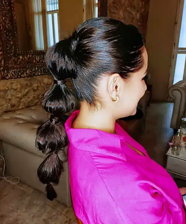 20. Espresso Black Statement Bubble Ponytail - Space Buns Hairstyles