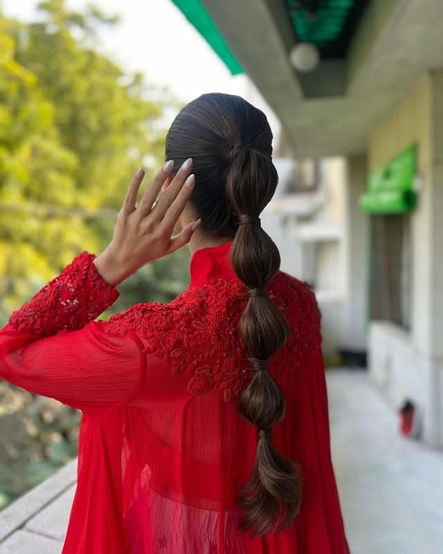 21. Dark Chocolate Brown Bubble Ponytail - Space Buns Hairstyles