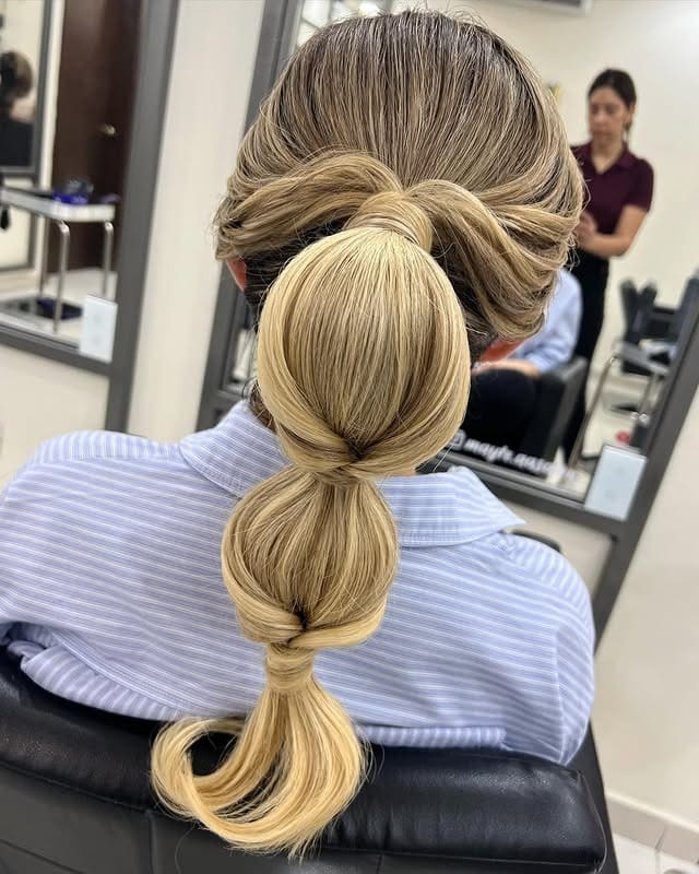 22. Beige Blonde Wrapped Bubble Ponytail - Space Buns Hairstyles